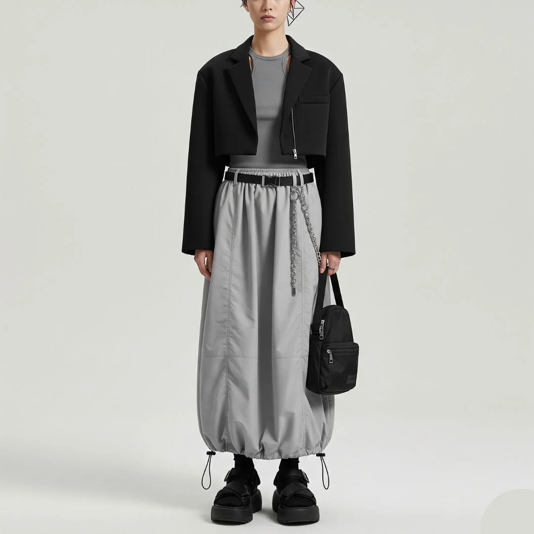 black cropped bolero jacket with gray tank and parachute maxi skirt